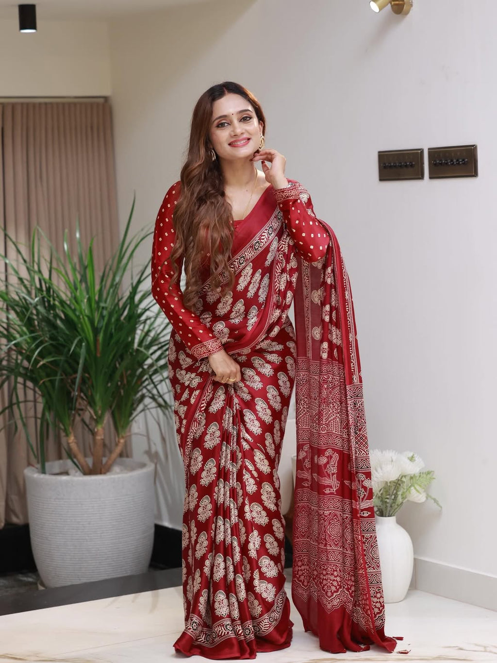 Elegant Red Printed Saree with Intricate Ethnic Motifs