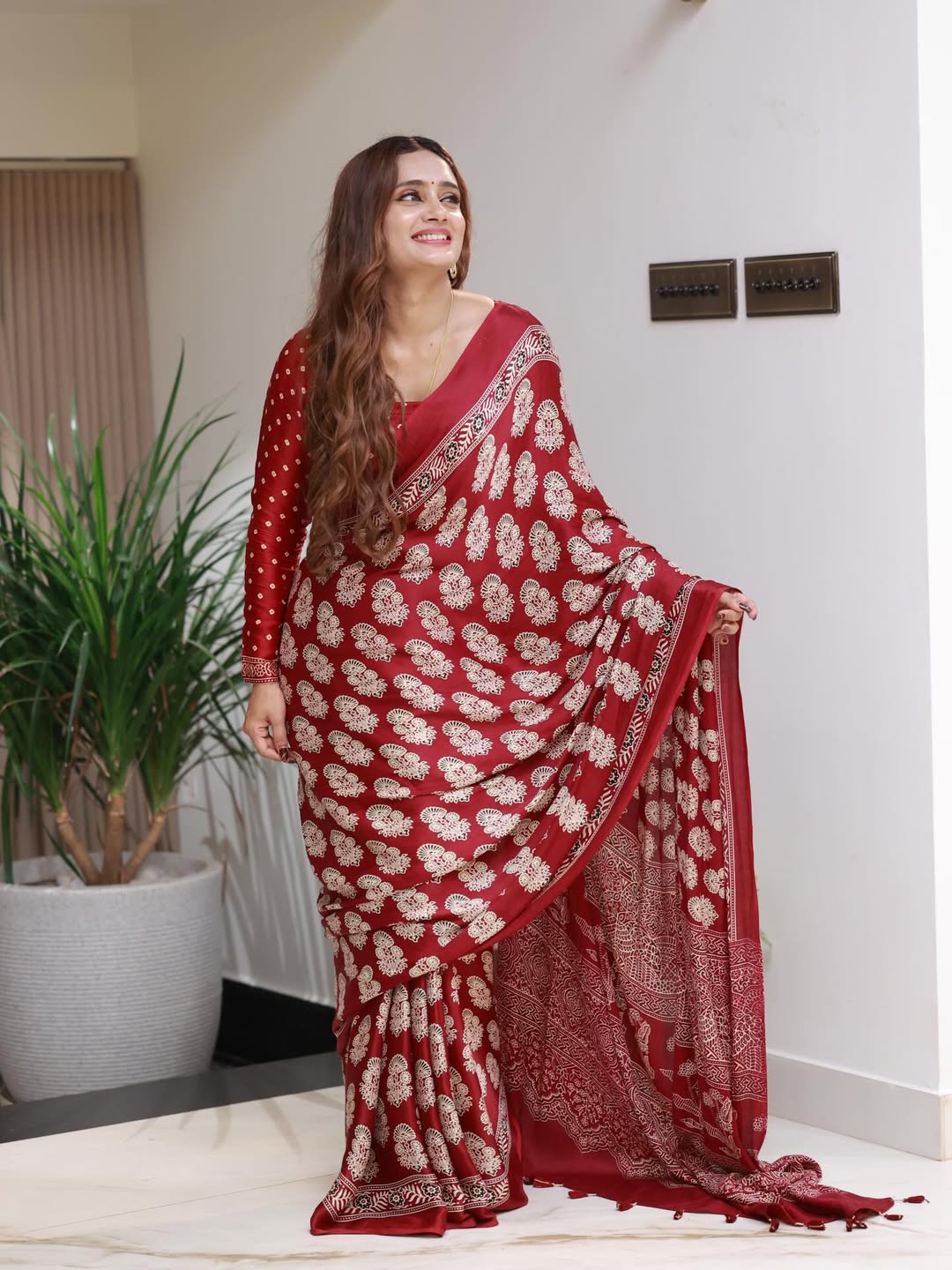 Elegant Red Printed Saree with Intricate Ethnic Motifs