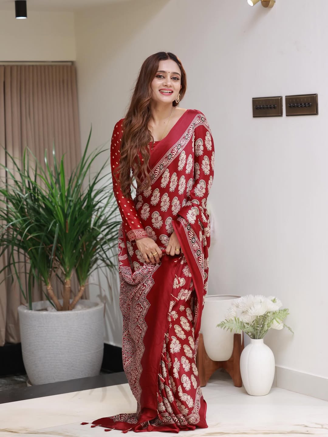 Elegant Red Printed Saree with Intricate Ethnic Motifs