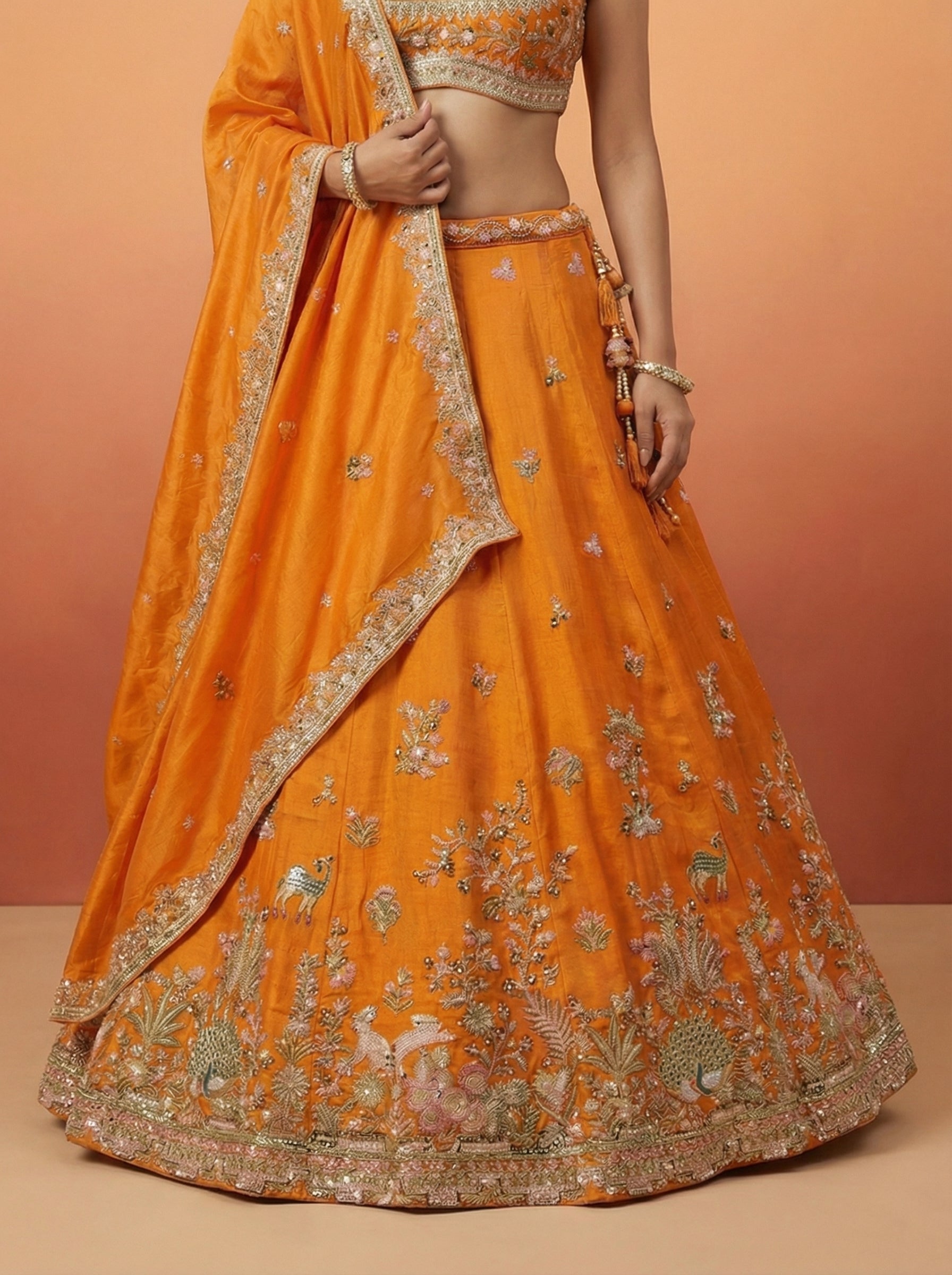 Orange Tissue Lahenga with colourful Peacock Embroidery