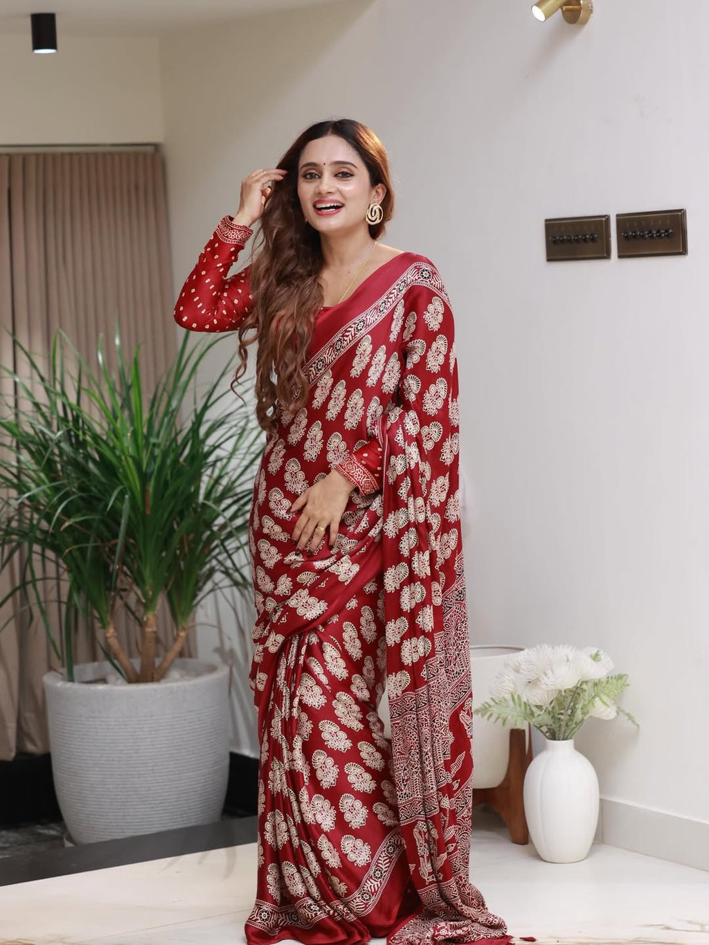 Elegant Red Printed Saree with Intricate Ethnic Motifs