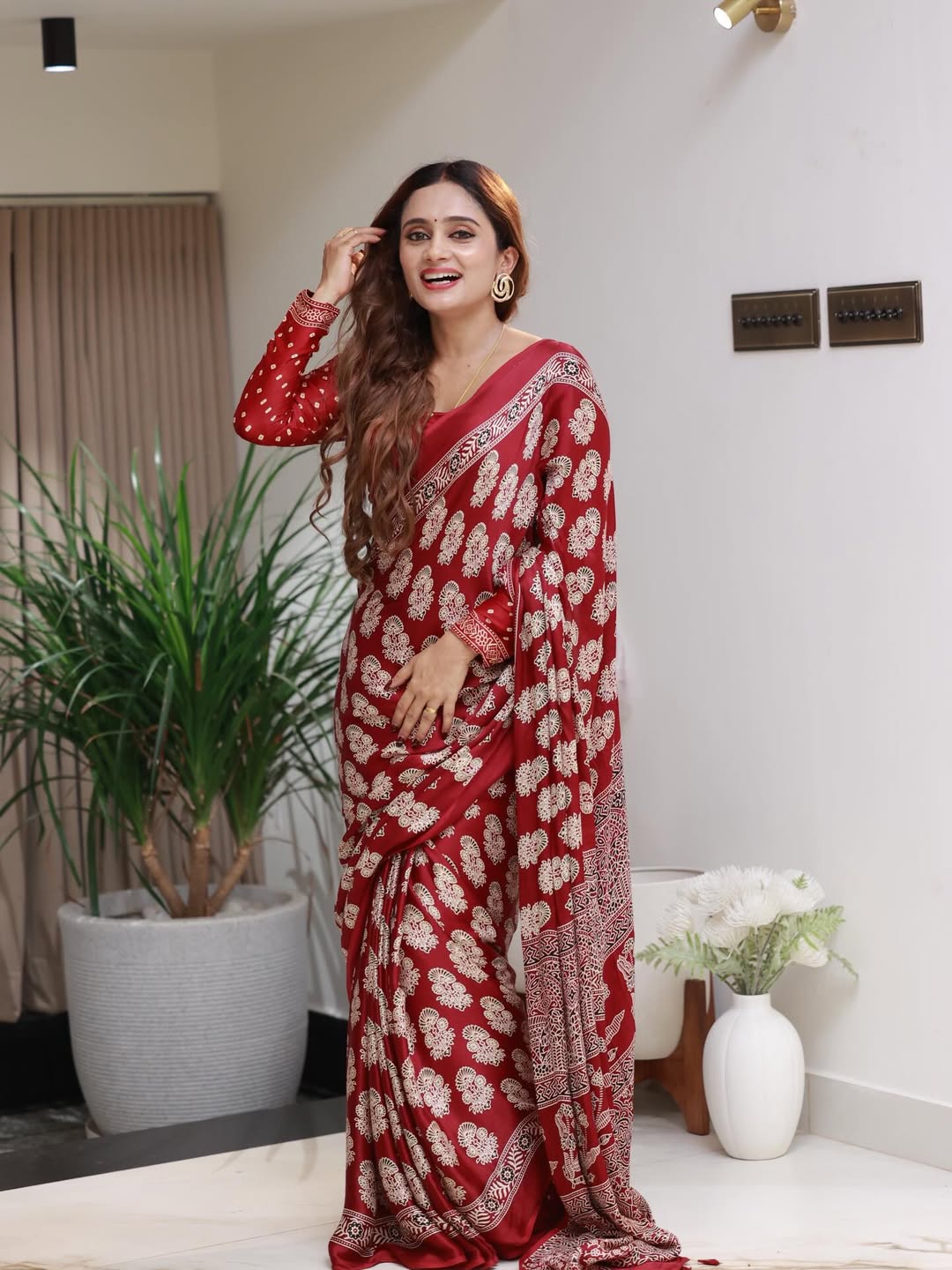 Elegant Red Printed Saree with Intricate Ethnic Motifs