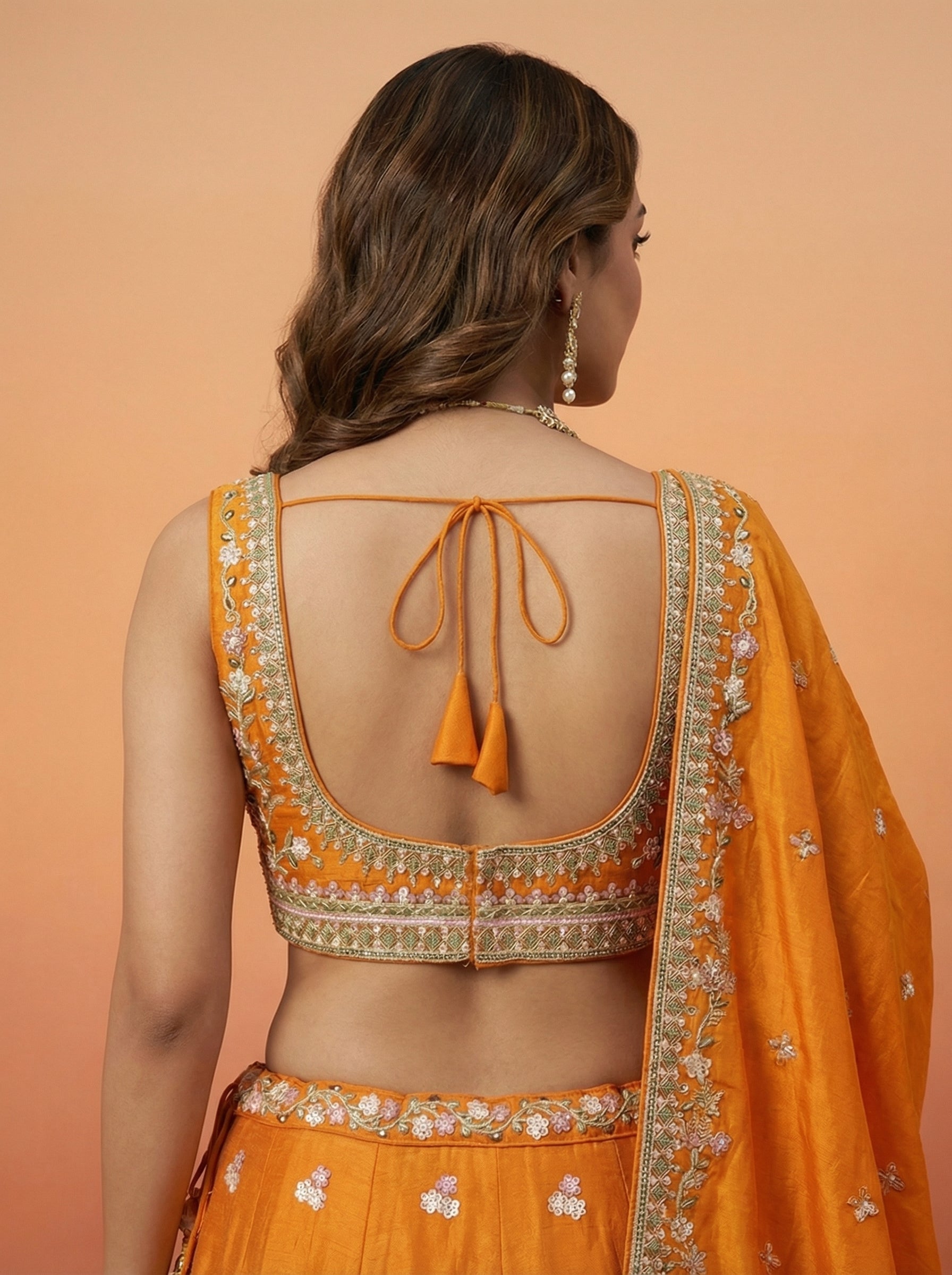 Orange Tissue Lahenga with colourful Peacock Embroidery