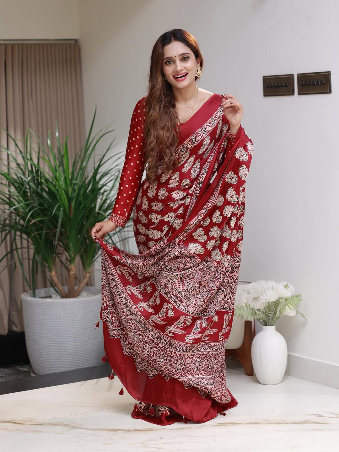 Elegant Red Printed Saree with Intricate Ethnic Motifs