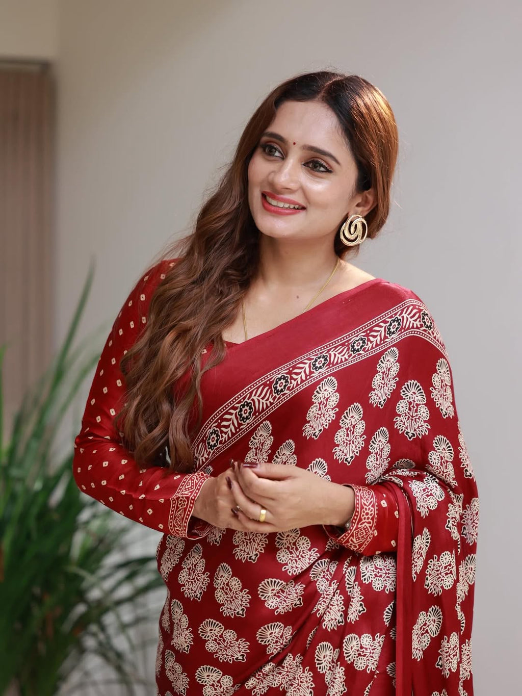Elegant Red Printed Saree with Intricate Ethnic Motifs